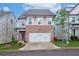 Charming two-story home featuring brick accents, a two-car garage, and a well-manicured lawn at 656 Avondale Park Cir, Decatur, GA 30032