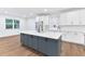 Kitchen features a center island, stainless steel appliances, and white cabinets at 656 Avondale Park Cir, Decatur, GA 30032