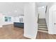 Open concept living room and kitchen featuring luxury vinyl plank floors and a kitchen island at 656 Avondale Park Cir, Decatur, GA 30032