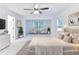 Virtually staged bedroom with elegant decor, plush bedding, and a cozy seating area by the window at 656 Avondale Park Cir, Decatur, GA 30032