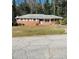 Charming brick home with a well-maintained lawn and a covered carport for convenient parking at 1979 Se Bencal Se Dr, Atlanta, GA 30316