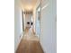 Hallway featuring neutral walls and flooring, leading to other rooms, ensuring privacy and separation of living spaces at 1979 Se Bencal Se Dr, Atlanta, GA 30316