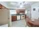 Efficient kitchen featuring retro appliances, classic cabinets, and a cozy breakfast nook, ready for your culinary creations at 1979 Se Bencal Se Dr, Atlanta, GA 30316
