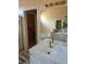 Bathroom featuring double sinks, a soaking tub, and a walk-in shower at 275 Rose Ivy Ct, Lawrenceville, GA 30043