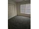 Bedroom with a closet and natural light at 275 Rose Ivy Ct, Lawrenceville, GA 30043