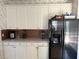 Traditional kitchen featuring white cabinets and stainless steel appliances at 275 Rose Ivy Ct, Lawrenceville, GA 30043
