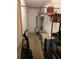 Functional utility room with water heater, storage shelves, and cleaning equipment at 275 Rose Ivy Ct, Lawrenceville, GA 30043