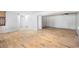 Finished basement boasting wood-look floors and neutral walls, awaiting personalization at 3274 Adelade Ct, Lithonia, GA 30038