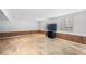 Spacious basement with updated floors, wood accents, and windows for natural light at 3274 Adelade Ct, Lithonia, GA 30038