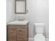 Bathroom showcasing modern fixtures, wood vanity, and neutral decor for a sleek look at 3274 Adelade Ct, Lithonia, GA 30038