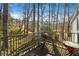 Balcony area with a grill and table, perfect for enjoying the outdoors at 3274 Adelade Ct, Lithonia, GA 30038