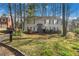 Charming two-story home with gray siding and lush front yard at 3274 Adelade Ct, Lithonia, GA 30038