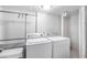 Laundry room featuring a modern, white washer and dryer for efficient cleaning at 3274 Adelade Ct, Lithonia, GA 30038