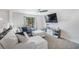 Bright and inviting living room featuring a plush sectional sofa and cozy ambiance at 3274 Adelade Ct, Lithonia, GA 30038