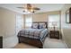 Bedroom with a queen bed, ceiling fan, and natural light from two windows at 2914 Lenox Ne Rd # 12, Atlanta, GA 30324