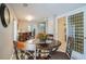 Cozy dining area featuring hardwood floors, dining set, and a view of the modern kitchen at 2914 Lenox Ne Rd # 12, Atlanta, GA 30324