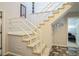 Carpeted stairs with white railing leading to the upper level of the home at 2914 Lenox Ne Rd # 12, Atlanta, GA 30324