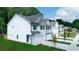 New townhome construction featuring a gray roof, white siding, and an attached single car garage at 4287 Notting Hill Dr # 64, Atlanta, GA 30331