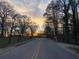 Scenic tree-lined street view at sunset at 5100 Alexander Ave, Union City, GA 30291