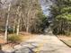 Street view of tree lined neighborhood with double yellow lines at 5100 Alexander Ave, Union City, GA 30291