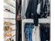 Organized closet space featuring clothing racks and shelves for shoes and storage at 12640 Hearthstone Way, Alpharetta, GA 30009