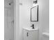 Modern bathroom with a shower, sleek vanity, and matte black fixtures at 6650 Baldwin Ct, Riverdale, GA 30274