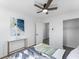 Bedroom with modern decor, ceiling fan, closet, and bright natural light at 6650 Baldwin Ct, Riverdale, GA 30274