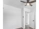 Bright bedroom with ceiling fan, wood floor and neutral wall color at 6650 Baldwin Ct, Riverdale, GA 30274