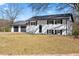 Beautiful home featuring a well-manicured lawn, a two-car garage, and classic architectural details at 6650 Baldwin Ct, Riverdale, GA 30274