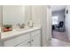 Bathroom vanity with white cabinets, quartz countertop, and chrome fixtures at 3836 Alice Ln, Suwanee, GA 30024