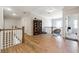 Spacious hallway featuring hardwood floors and a decorative bookcase at 3836 Alice Ln, Suwanee, GA 30024