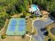 Aerial view showcases community amenities, including a pool, tennis courts, and playground at 551 Rokeby Dr, Woodstock, GA 30188
