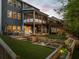 Multi-level backyard with deck, screened porch, putting green, fire pit and tasteful landscaping at 551 Rokeby Dr, Woodstock, GA 30188