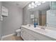 Bathroom featuring double sinks and tiled floors at 551 Rokeby Dr, Woodstock, GA 30188