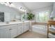 Bathroom featuring double sinks, separate tub and tiled floors at 551 Rokeby Dr, Woodstock, GA 30188