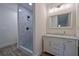 Contemporary bathroom featuring a tiled shower and white vanity with marble countertop at 551 Rokeby Dr, Woodstock, GA 30188
