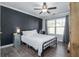 Contemporary bedroom with a large window letting in lots of light and hardwood floors at 551 Rokeby Dr, Woodstock, GA 30188