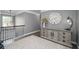 Hallway landing area featuring a large clock, area rug and hardwood floors at 551 Rokeby Dr, Woodstock, GA 30188