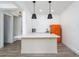 Living room with an open design featuring a bar, a luxury vinyl plank floor, and a orange refrigerator at 551 Rokeby Dr, Woodstock, GA 30188