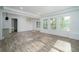 Bright living room with luxury vinyl plank flooring, recessed lighting, and three bright windows at 551 Rokeby Dr, Woodstock, GA 30188