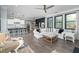 Bright and airy living room with hardwood floors, large windows, and an open layout at 551 Rokeby Dr, Woodstock, GA 30188