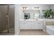 Bathroom featuring double sinks, glass enclosed shower and tiled floors at 551 Rokeby Dr, Woodstock, GA 30188