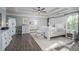 Spacious main bedroom with trey ceilings, hardwood floors and a large dresser at 551 Rokeby Dr, Woodstock, GA 30188