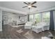 Spacious main bedroom suite with seating area, ensuite bathroom, and plenty of natural light at 551 Rokeby Dr, Woodstock, GA 30188