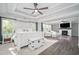 Spacious main bedroom features tray ceilings, fireplace, and views of the backyard and the woods at 551 Rokeby Dr, Woodstock, GA 30188