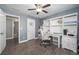 Charming office with built in shelving, gray walls, wood floors, and bright light fixture at 551 Rokeby Dr, Woodstock, GA 30188
