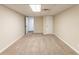 This carpeted basement features neutral paint, a drop ceiling, and access to other areas at 1059 Buckboard Ct, Douglasville, GA 30134