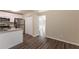 Open-concept kitchen featuring stainless steel appliances and an adjacent dining area at 1059 Buckboard Ct, Douglasville, GA 30134