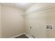 The laundry area features new vinyl flooring, neutral paint, washer hookups, and a shelf at 1059 Buckboard Ct, Douglasville, GA 30134
