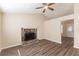 Spacious living room featuring a stone fireplace, hardwood floors, and natural light at 1059 Buckboard Ct, Douglasville, GA 30134